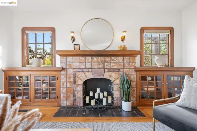 a living room with furniture and a clock