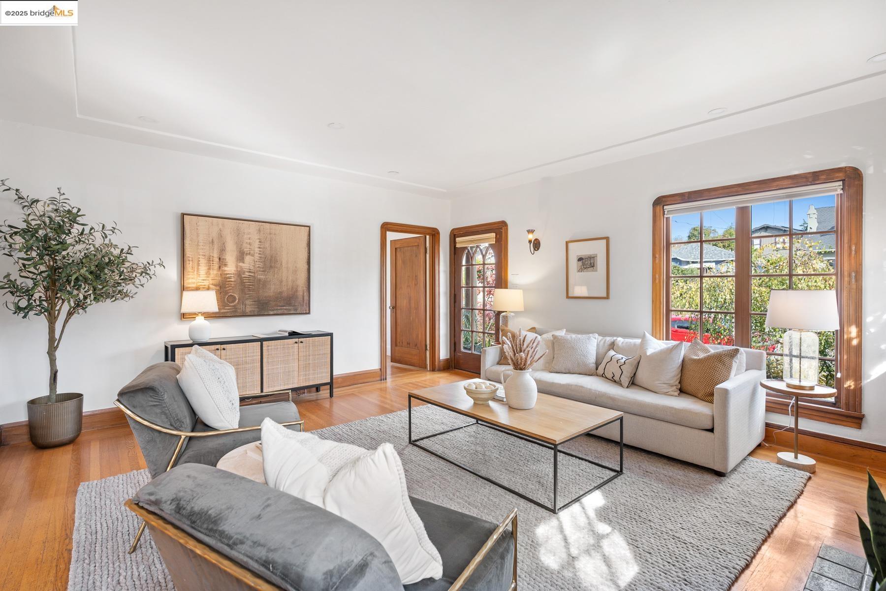 1614 Posen Avenue Berkeley, CA 94707 - Photo 8 of 60 a living room with furniture and a wooden floor