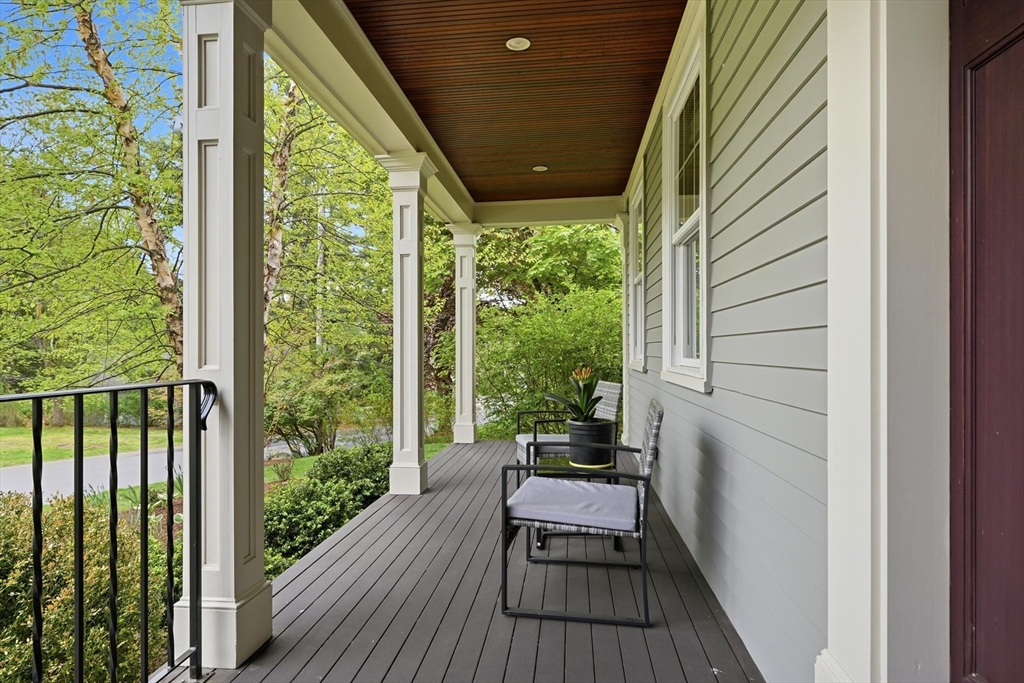 6 Flintlock Road Lexington, MA 02420 - Photo 35 of 39 a view of balcony with chairs and wooden floor
