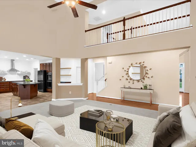 a kitchen with stainless steel appliances granite countertop a refrigerator a stove and a sink