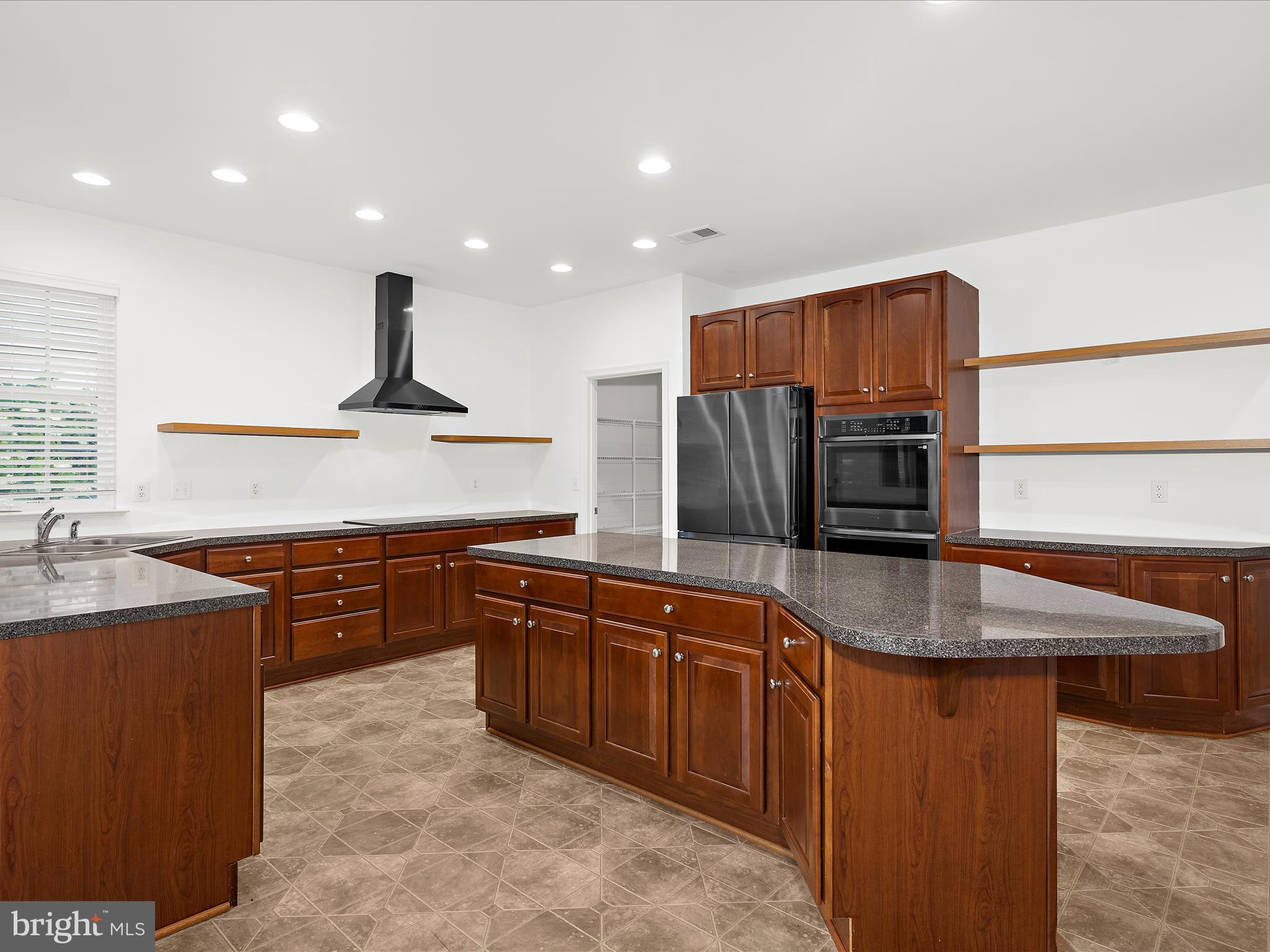 103 Adela Way Chestertown, MD 21620 - Photo 15 of 90 a kitchen with stainless steel appliances granite countertop a sink a stove and a refrigerator
