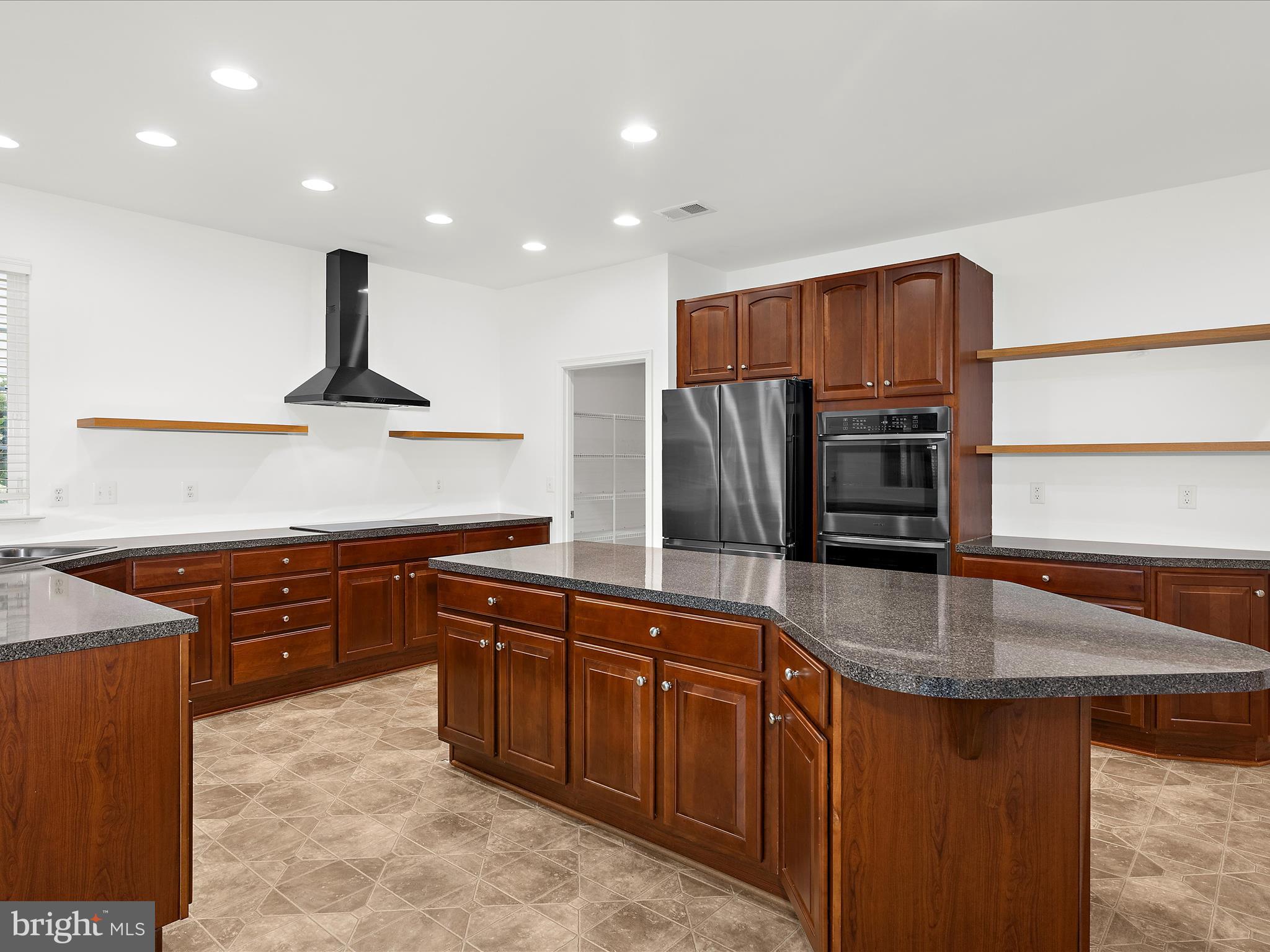 103 Adela Way Chestertown, MD 21620 - Photo 27 of 90 a kitchen with stainless steel appliances granite countertop a sink a stove and a refrigerator