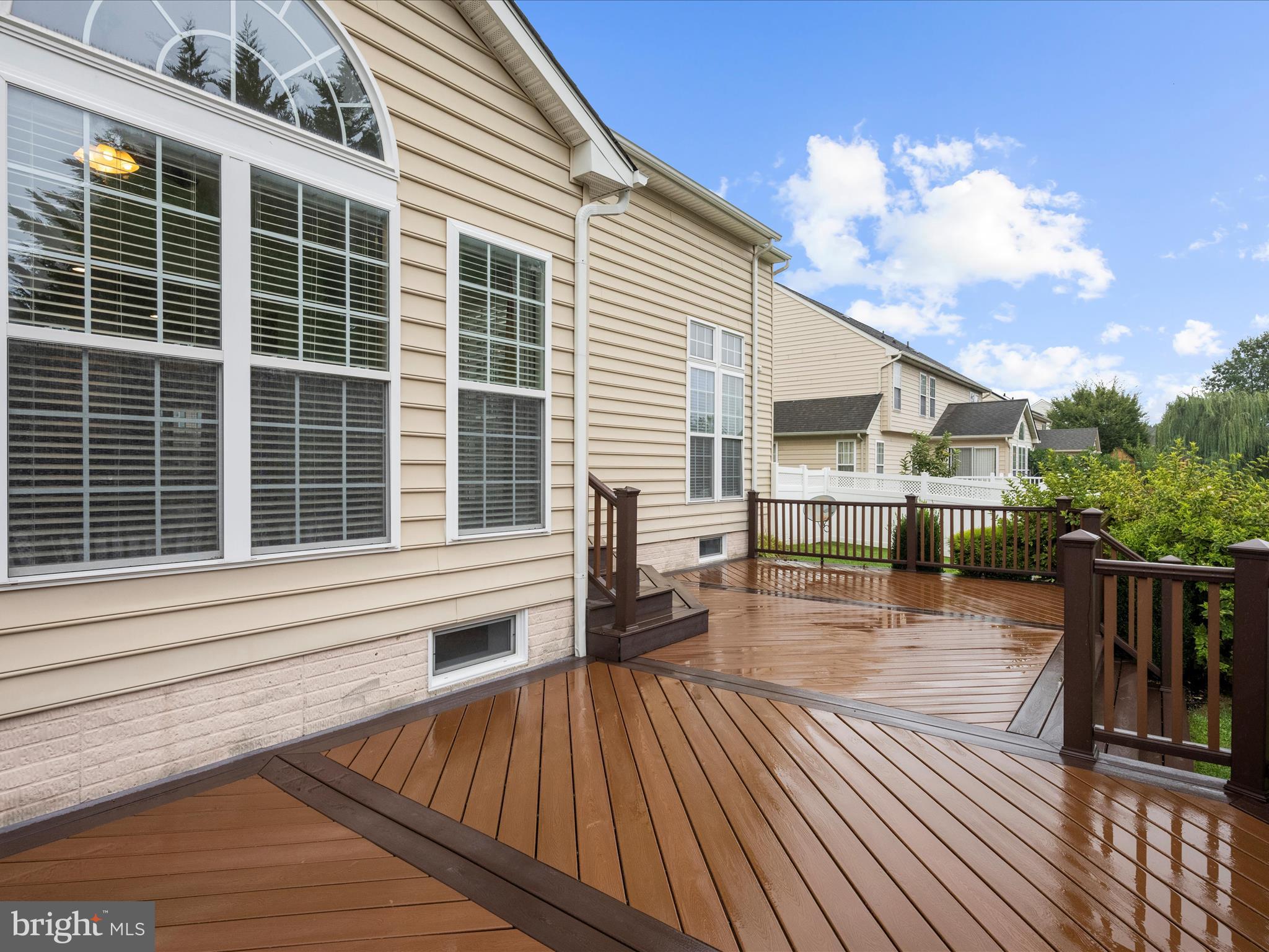 103 Adela Way Chestertown, MD 21620 - Photo 86 of 90 a view of a roof deck with table and chairs a barbeque with wooden floor and fence