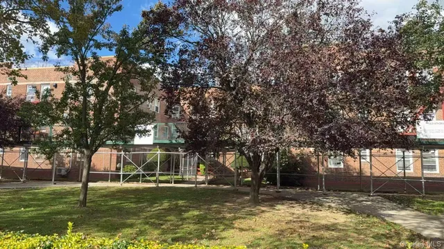 a front view of a house with a yard garage and outdoor seating