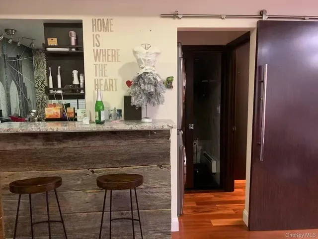 a table with chairs in front of a door