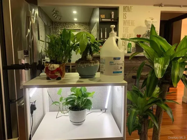 a vase of flowers sitting on a table with window