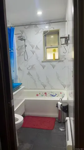 a bathroom with a sink a toilet and bathtub