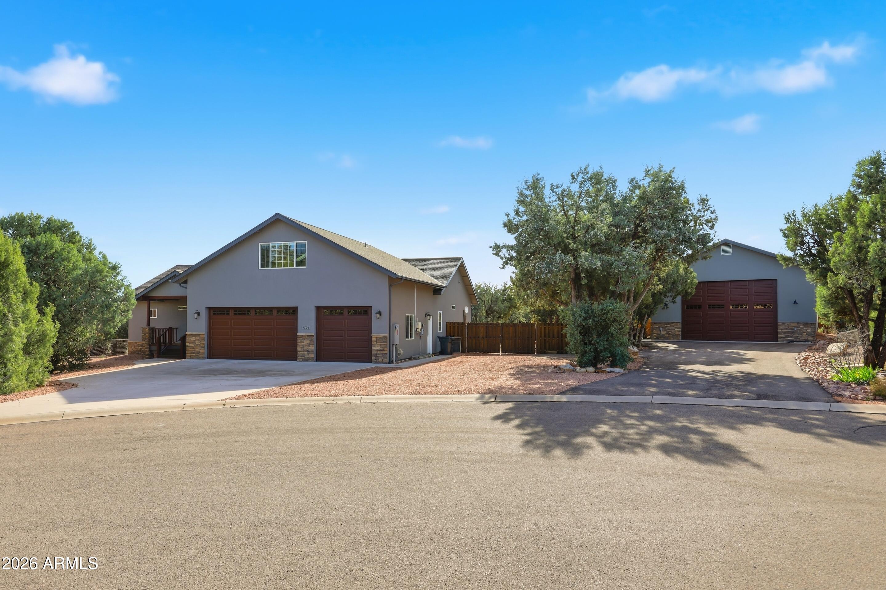 1703 West Dillon Way Payson, AZ 85541 - Photo 1 of 56 a house with trees in the background