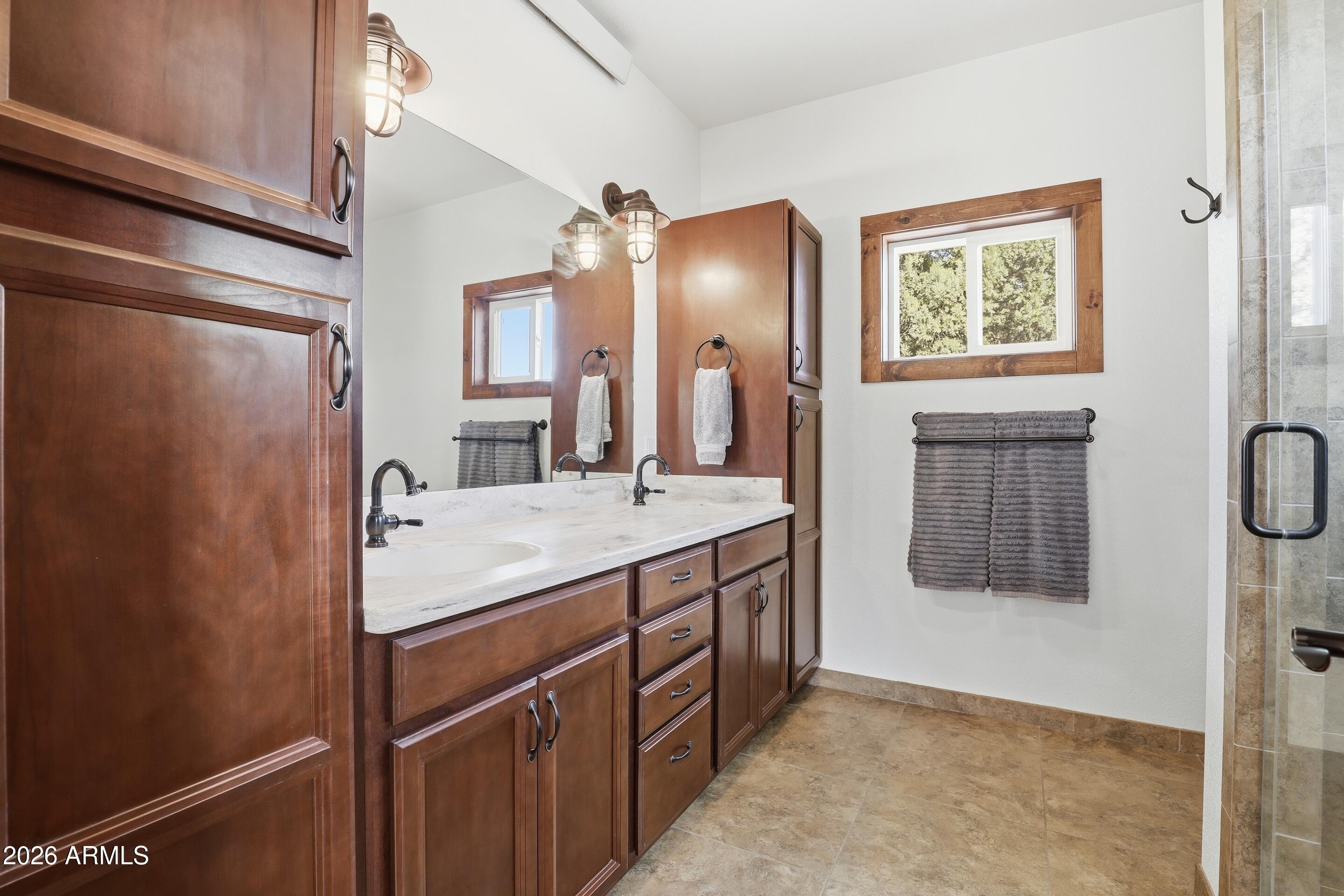 1703 West Dillon Way Payson, AZ 85541 - Photo 15 of 56 a bathroom with a sink and a mirror