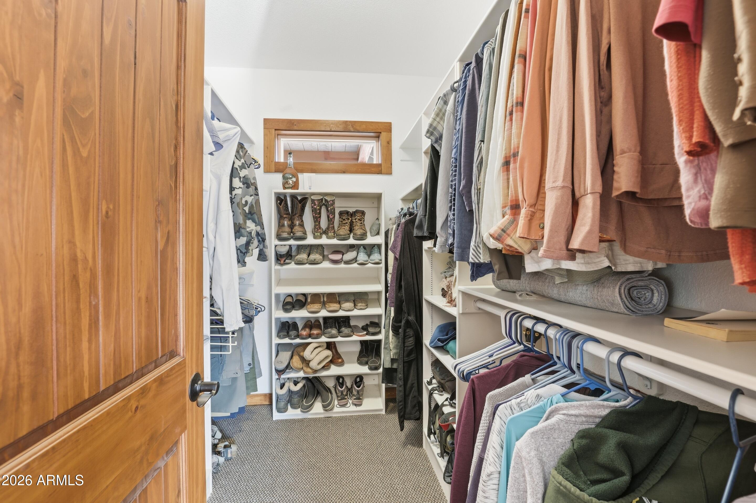 1703 West Dillon Way Payson, AZ 85541 - Photo 17 of 56 a view of walk in closet with clothes and shoes
