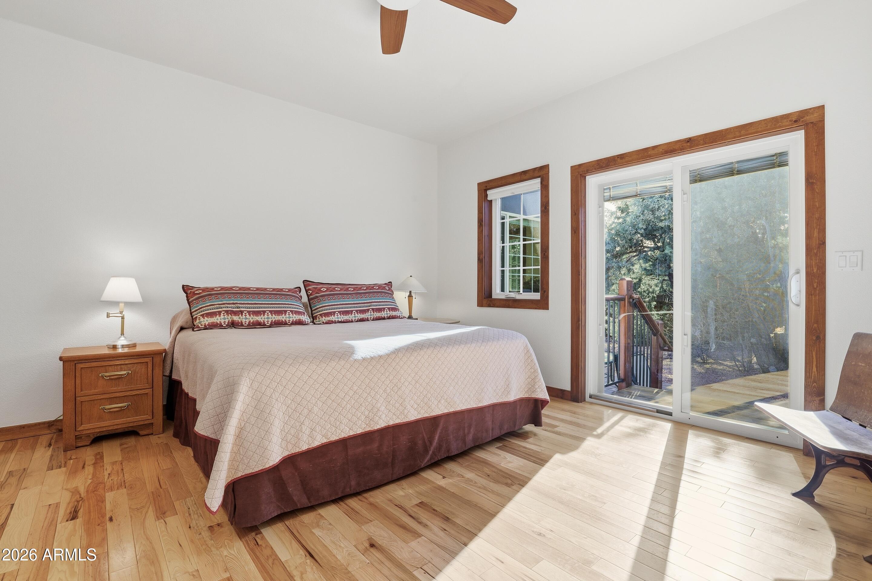 1703 West Dillon Way Payson, AZ 85541 - Photo 19 of 56 a bedroom with a bed and large window