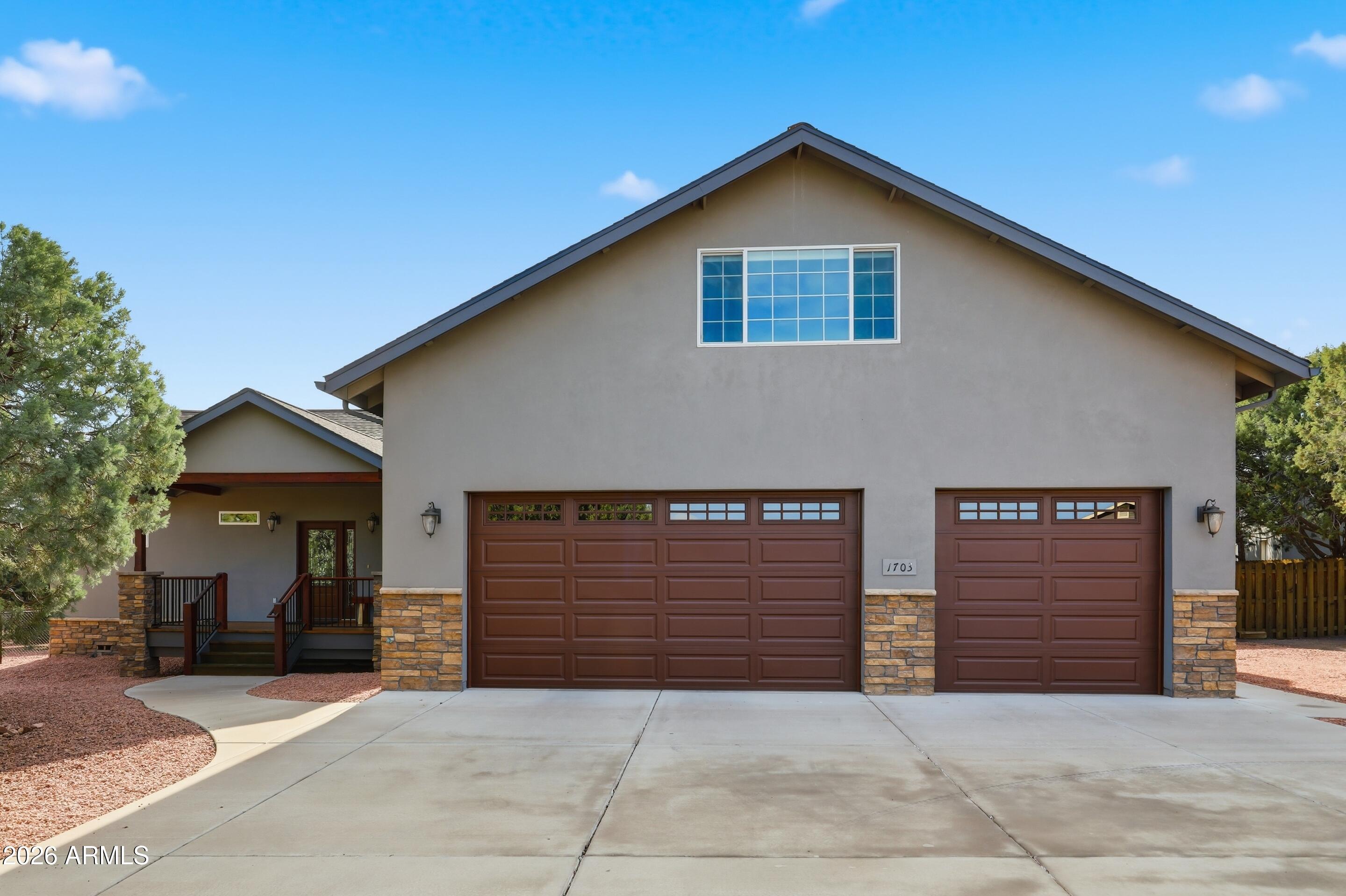 1703 West Dillon Way Payson, AZ 85541 - Photo 29 of 56 a front view of a house with garage