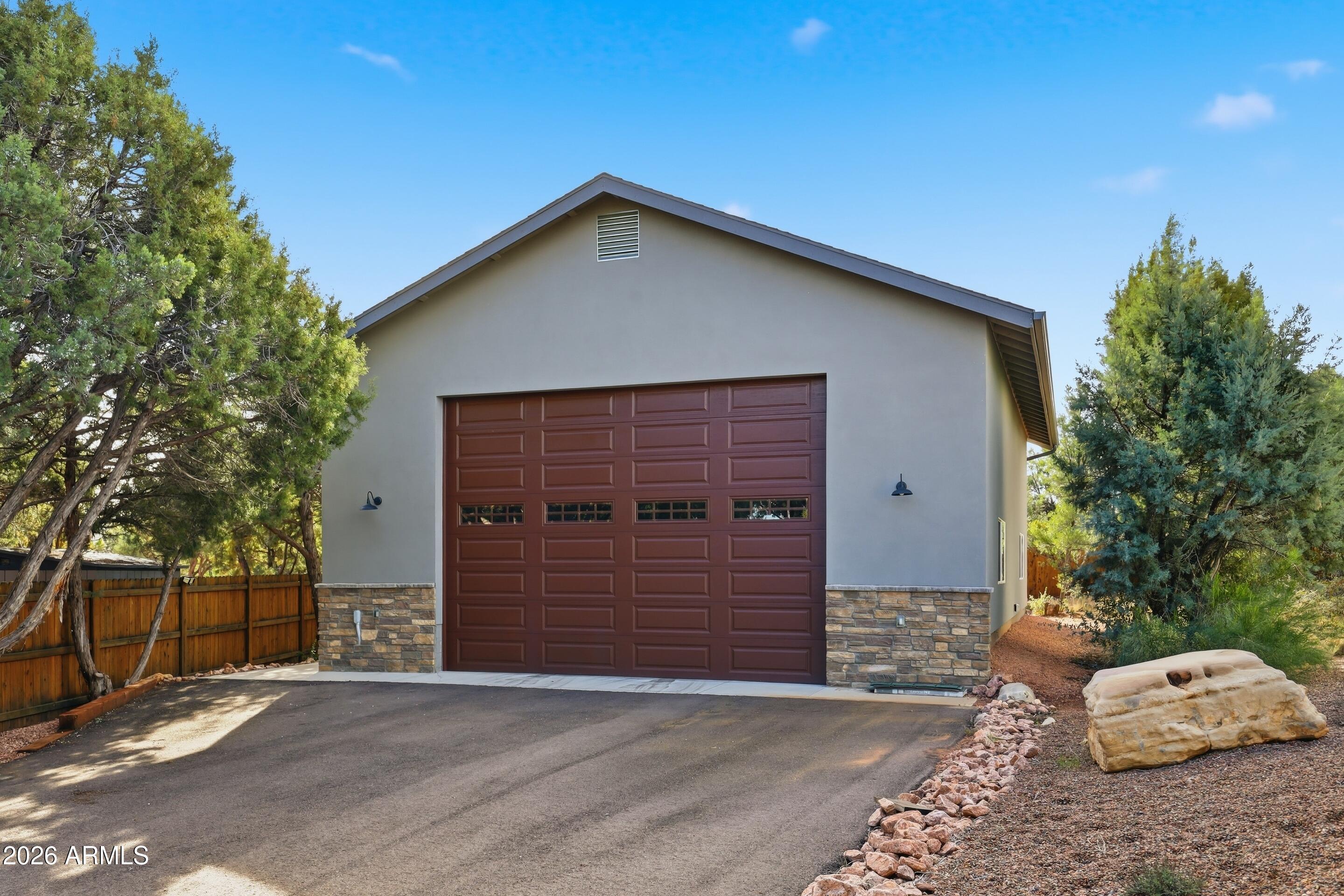 1703 West Dillon Way Payson, AZ 85541 - Photo 33 of 56 a front view of a house with a garage