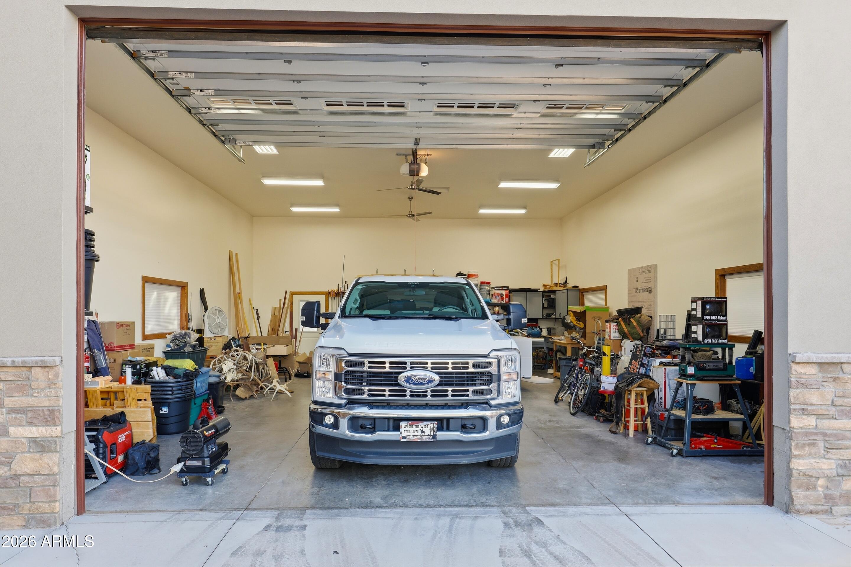 1703 West Dillon Way Payson, AZ 85541 - Photo 35 of 56 a living room with lots of furniture and a chandelier