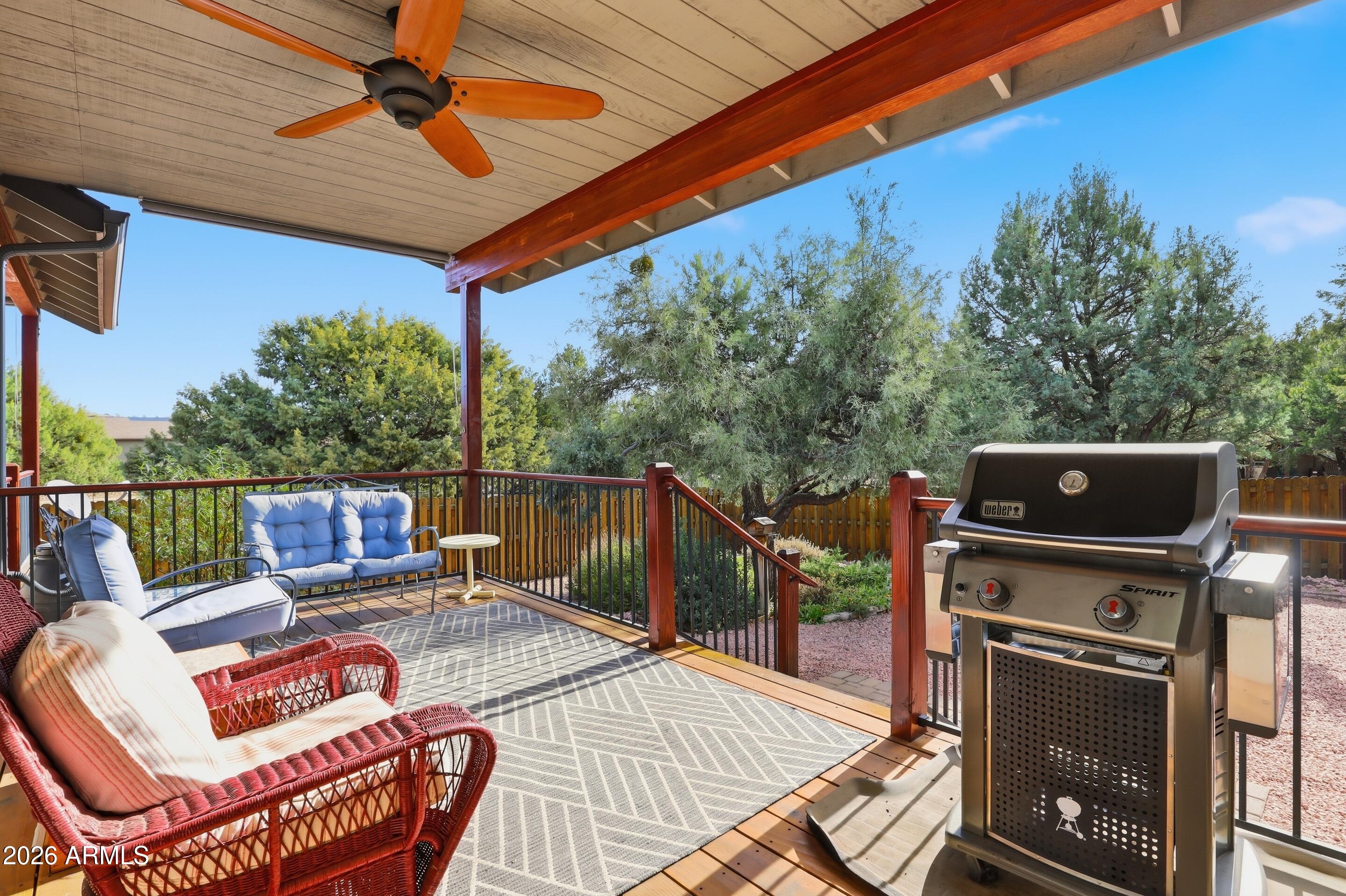 1703 West Dillon Way Payson, AZ 85541 - Photo 37 of 56 a patio with water view fountain with wooden floor and fence