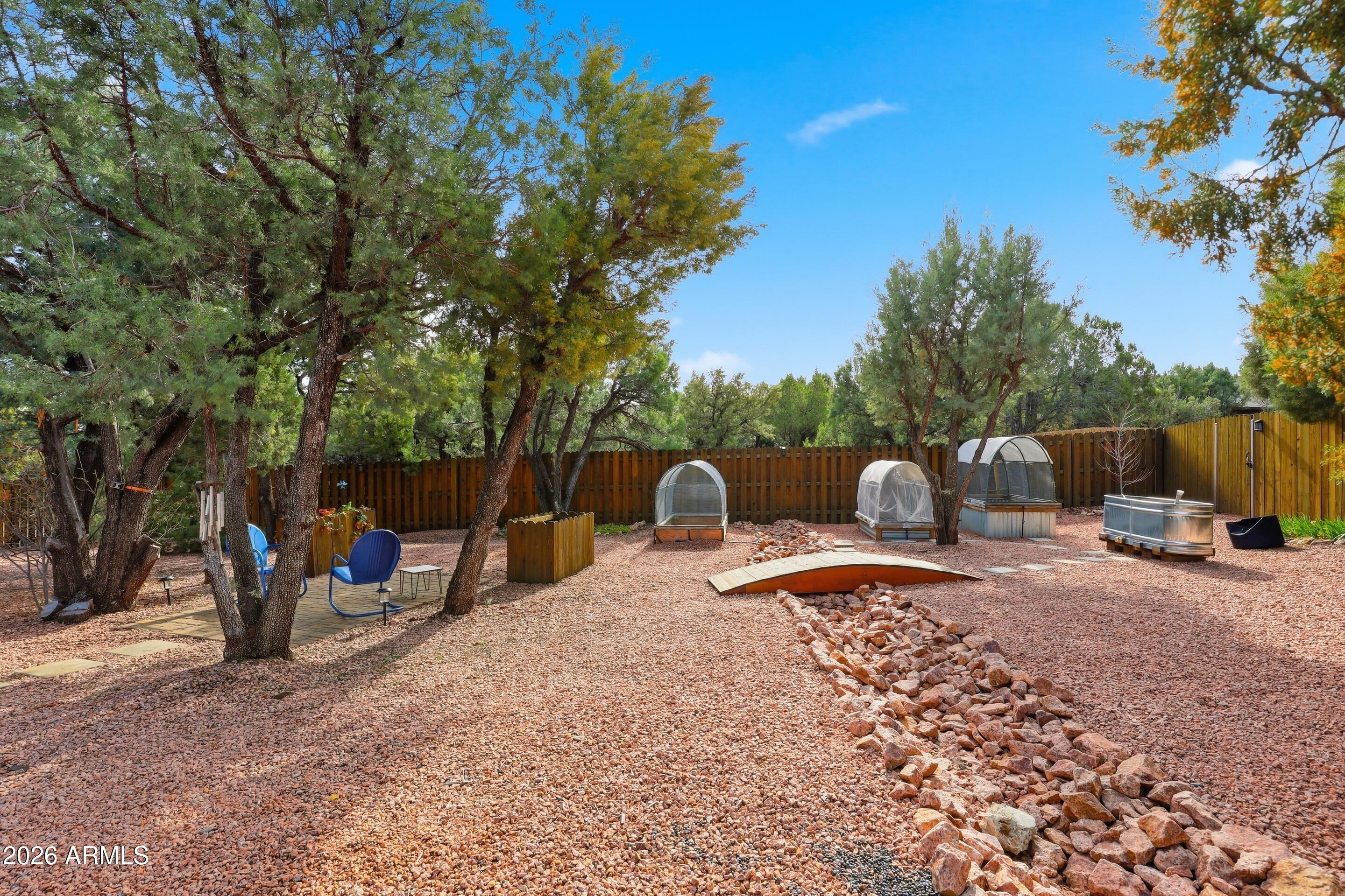 1703 West Dillon Way Payson, AZ 85541 - Photo 46 of 56 a view of a outdoor space with furniture and garden