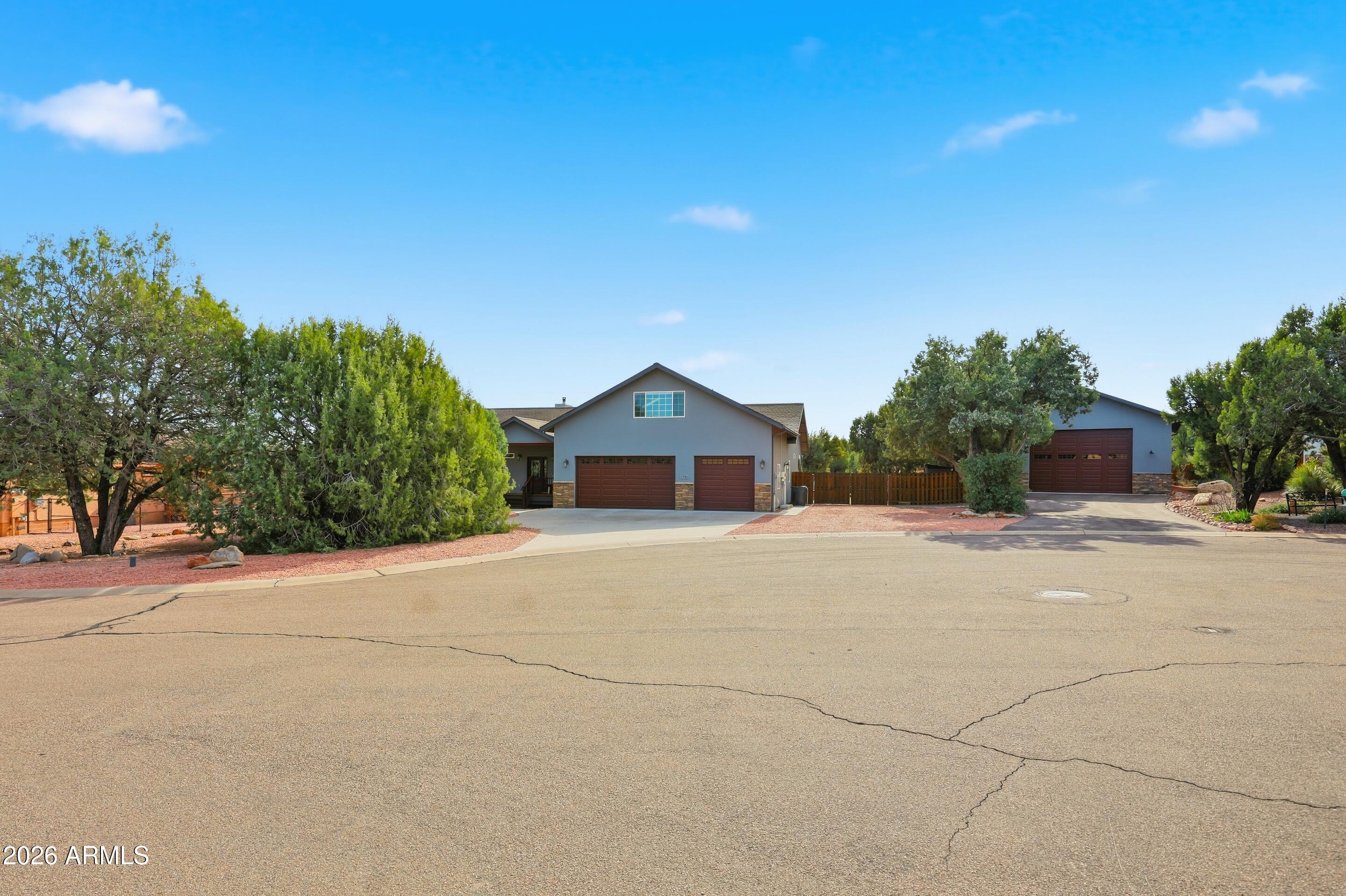 1703 West Dillon Way Payson, AZ 85541 - Photo 50 of 56 a house with trees in front of it