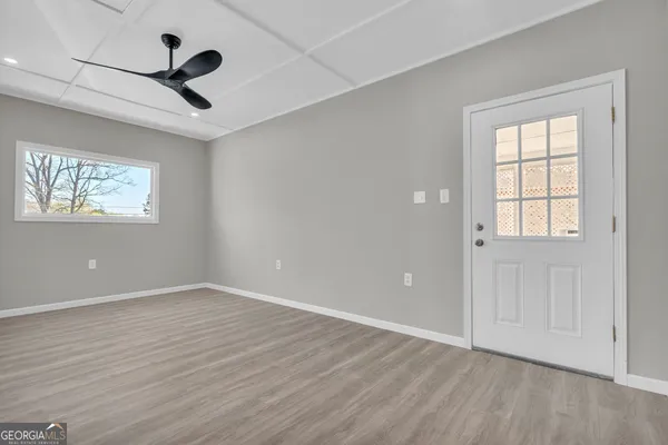 a view of storage and utility room with wooden floor