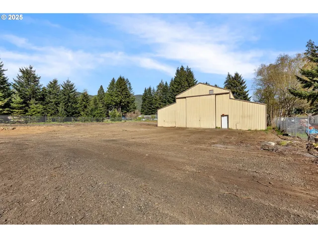 a view of a backyard of the house