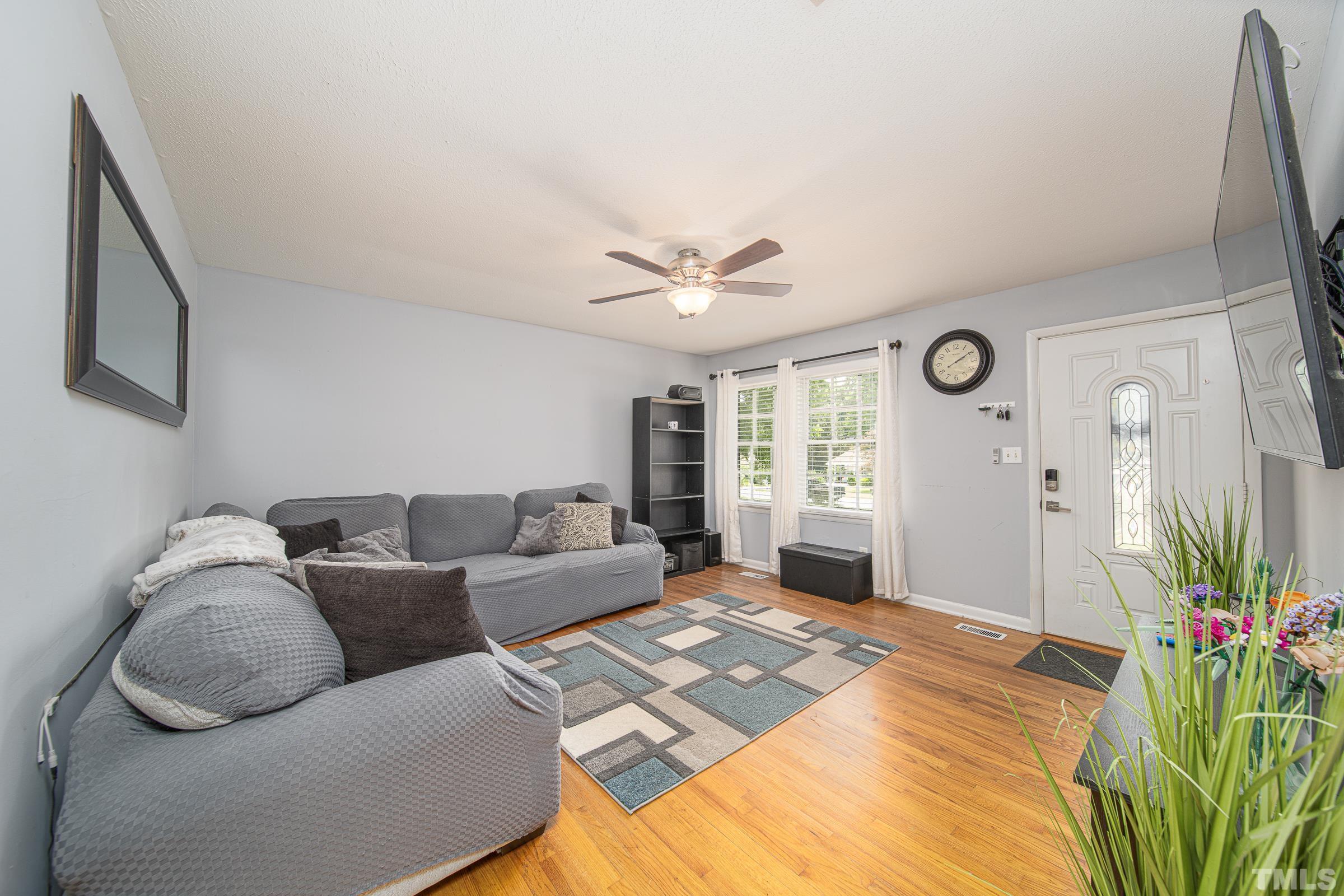 6325 Diamond Drive Raleigh, NC 27610 - Photo 8 of 25 a living room with furniture and a large window
