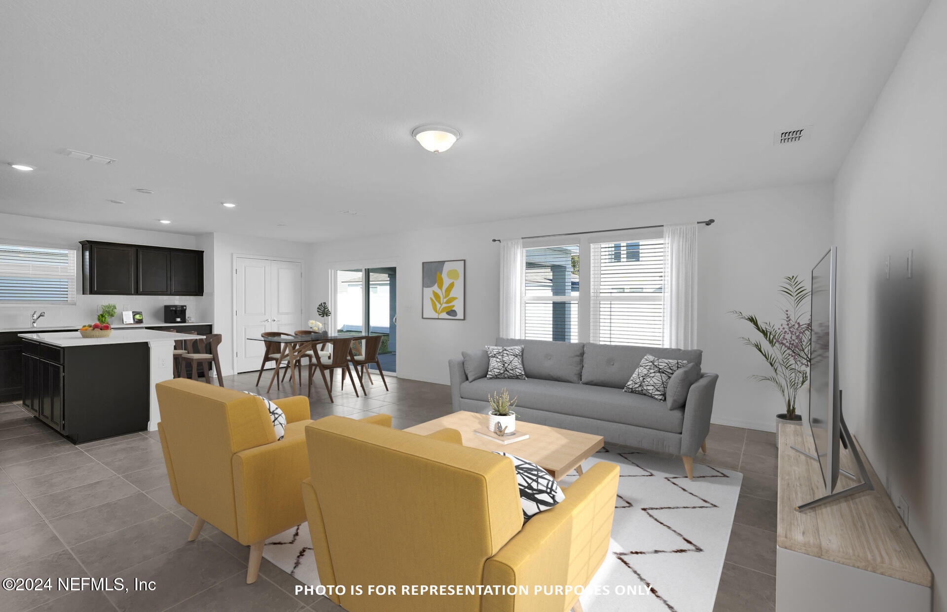 5441 Integrity Way Jacksonville, FL 32244 - Photo 14 of 38 a living room with furniture a flat screen tv and a window