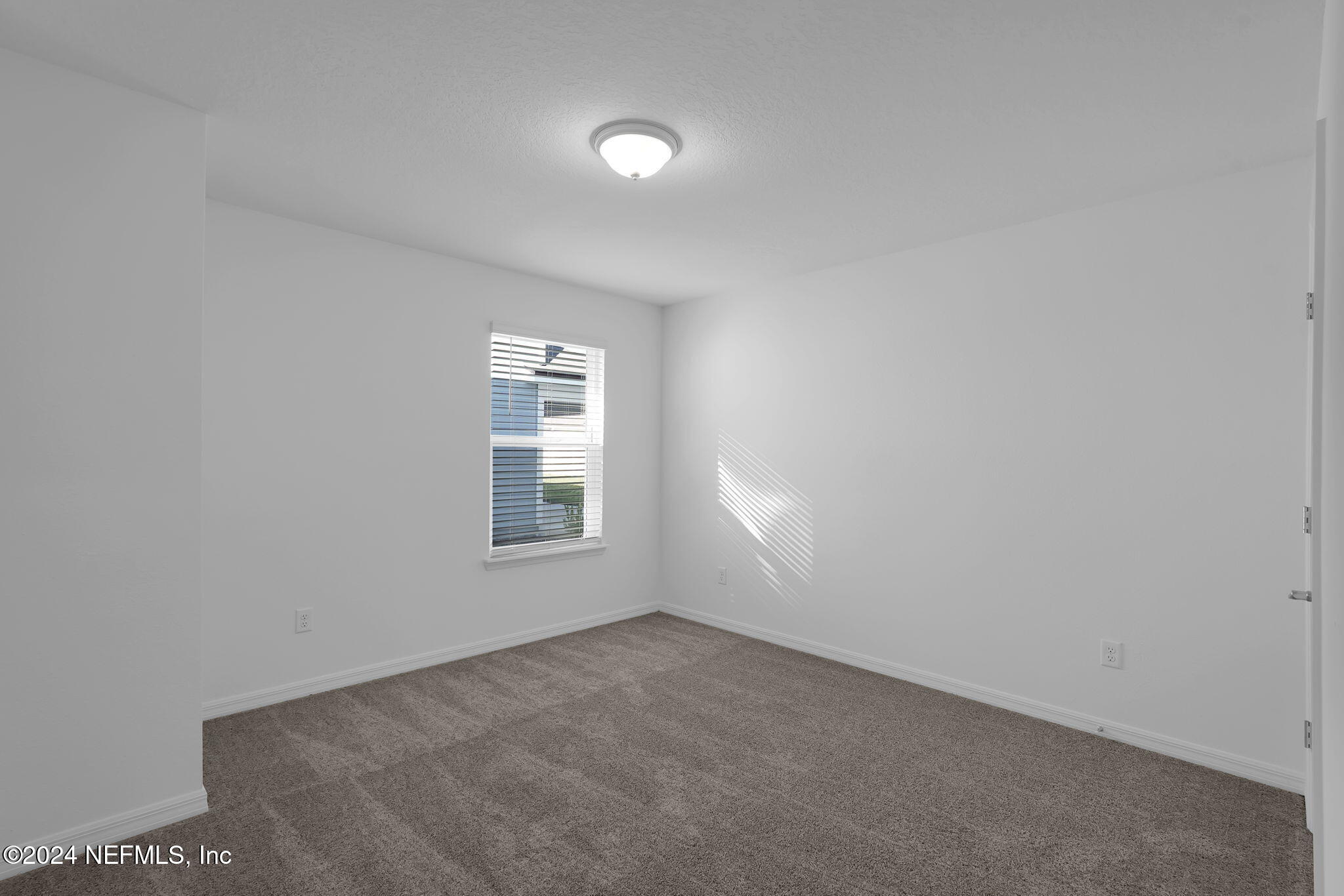 5441 Integrity Way Jacksonville, FL 32244 - Photo 29 of 38 an empty room with a window