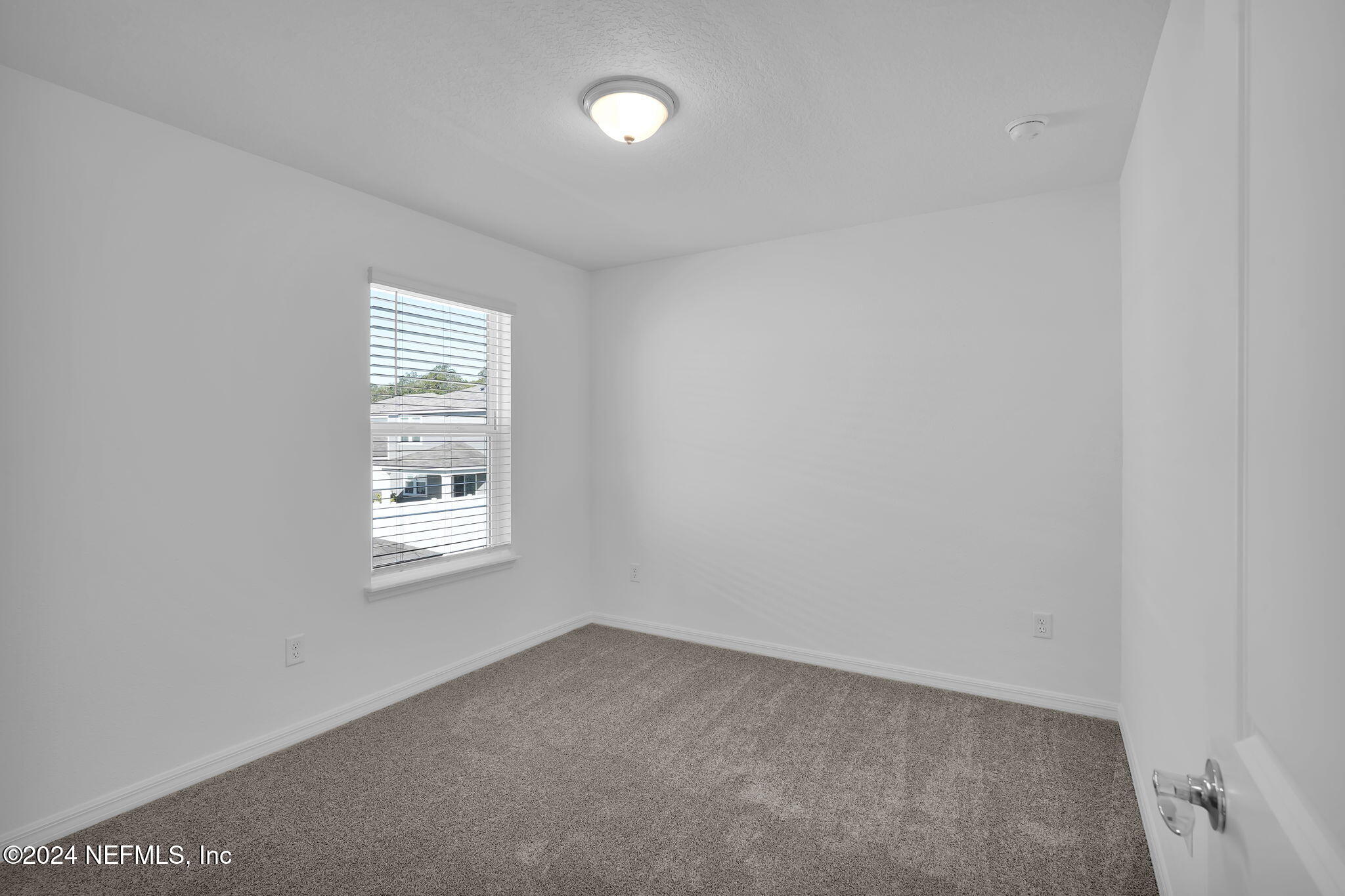 5441 Integrity Way Jacksonville, FL 32244 - Photo 31 of 38 an empty room with a window