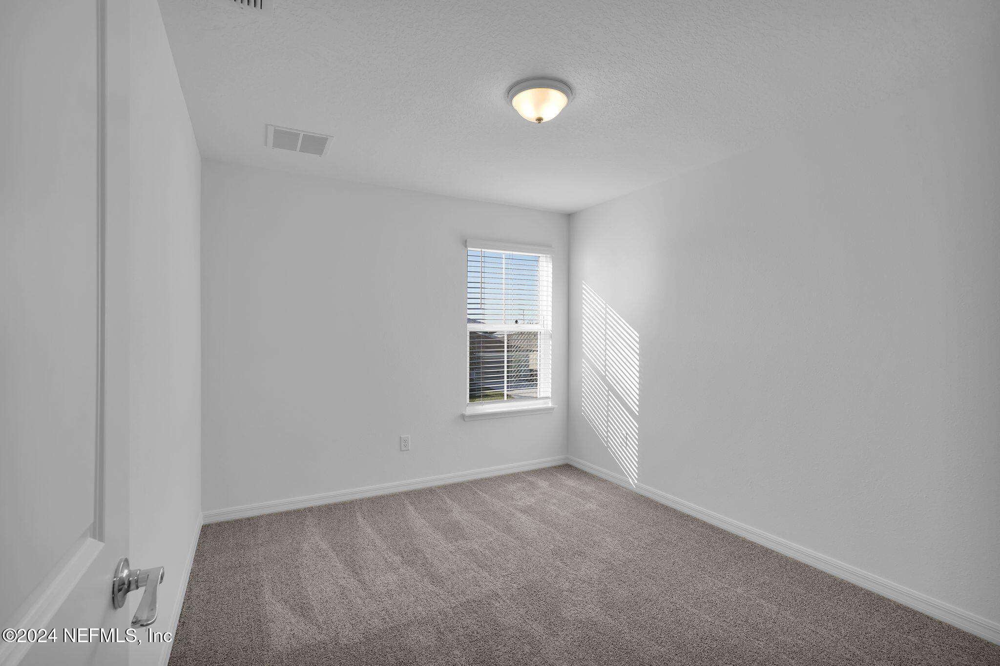 5441 Integrity Way Jacksonville, FL 32244 - Photo 33 of 38 a view of an empty room with a window