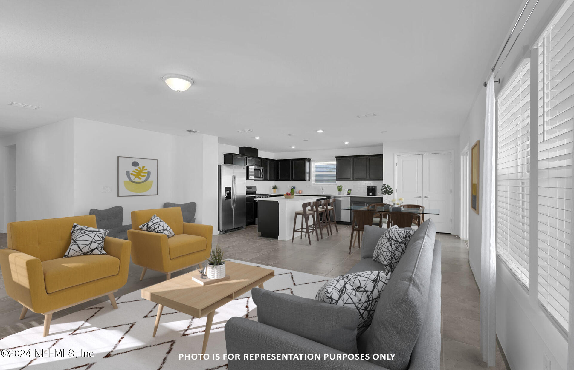 5441 Integrity Way Jacksonville, FL 32244 - Photo 6 of 38 a living room with furniture and flat screen tv