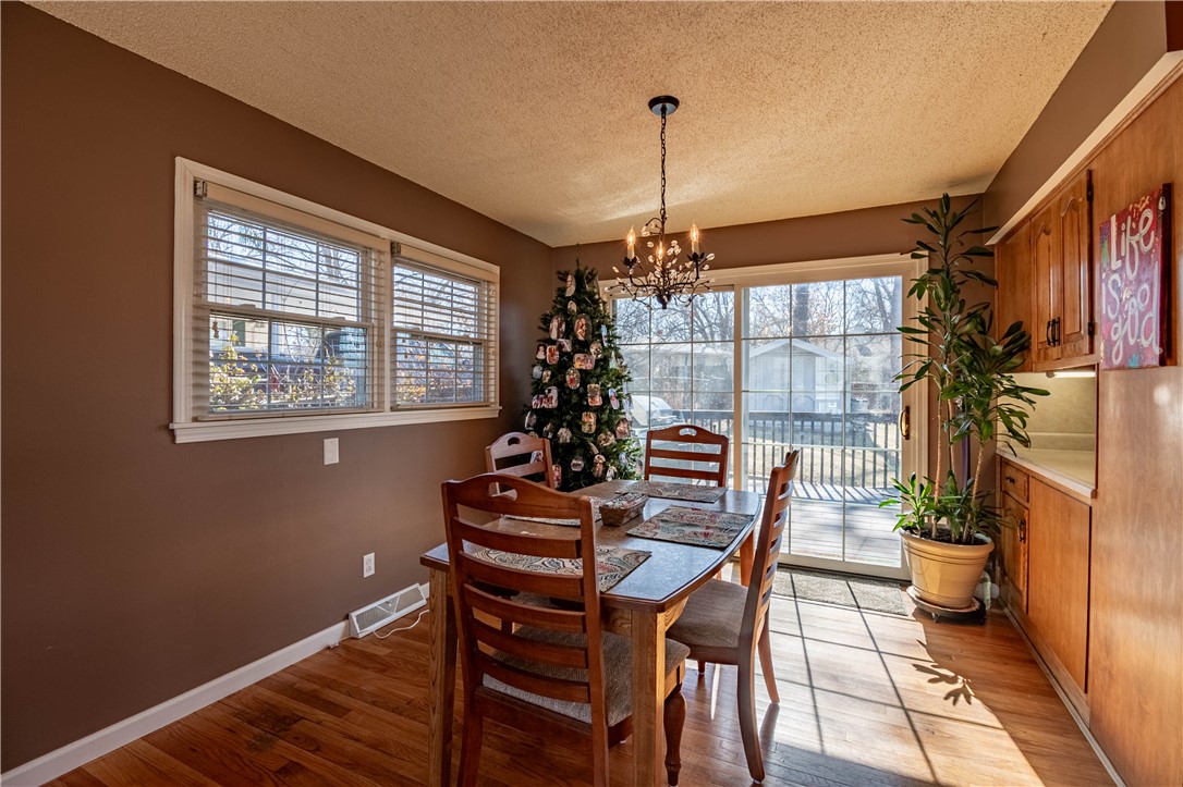 75 Ridgedale Drive Decatur, IL 62521 - Photo 6 of 26 a view of a dining room with furniture window and wooden floor