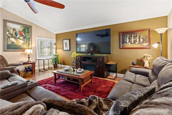 a dining room with furniture a rug and a chandelier