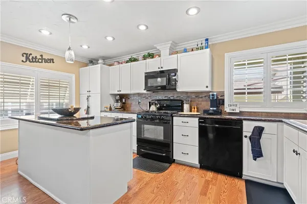 a view of a porch with furniture and garden