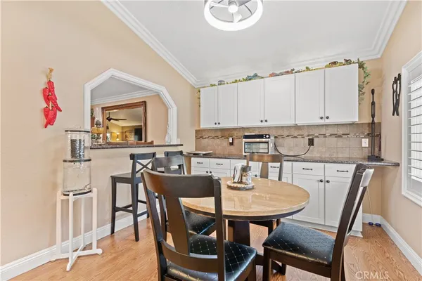 a living room with furniture flower pot and a fireplace