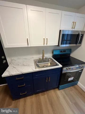 a room with a sink and a mirror