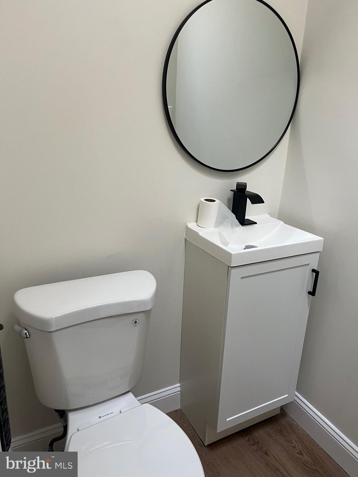 904 South Cecil Street Philadelphia, PA 19143 - Photo 8 of 18 a white toilet sitting next to a bathroom sink