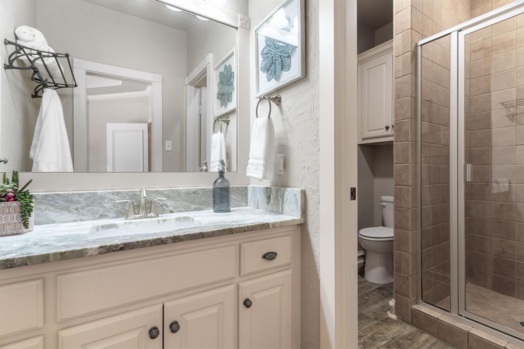 2404 Racheal Drive Heath, TX 75032 - Photo 26 of 40 A separate vanity room connects bedroom 3 to the second-floor bathroom, offering the privacy of an en suite bathroom.