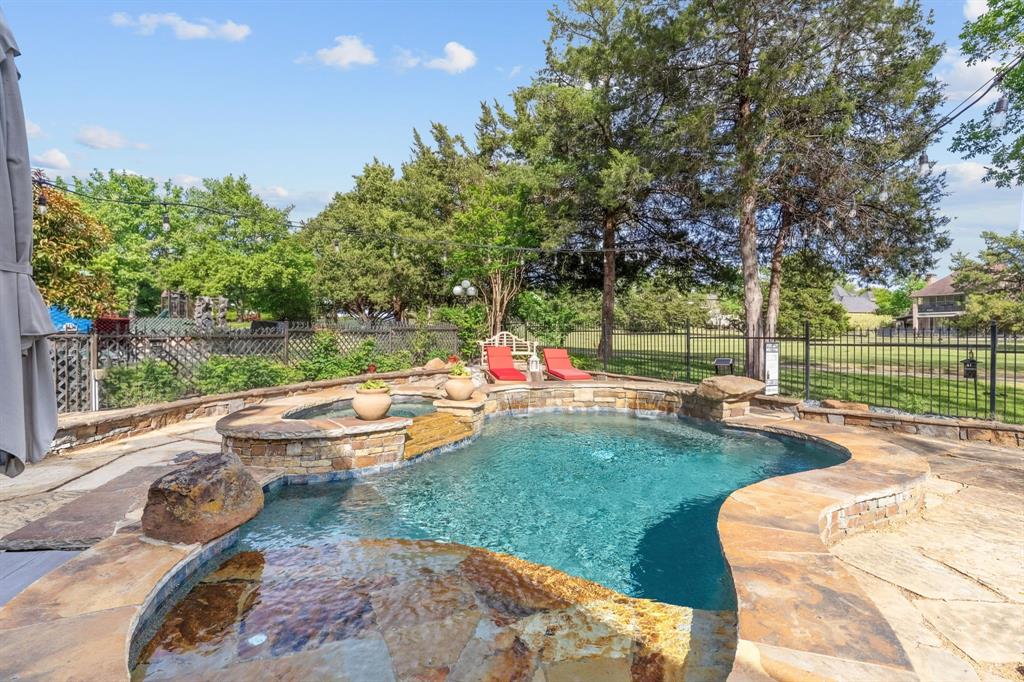 2404 Racheal Drive Heath, TX 75032 - Photo 34 of 40 Heated pool and spa with cascading waterfalls