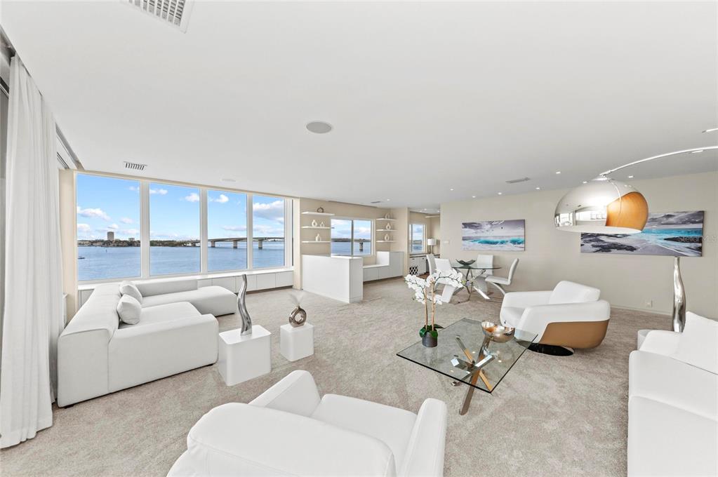 350 Golden Gate Point, Unit 61 Sarasota, FL 34236 - Photo 14 of 48 a living room with furniture and a large window