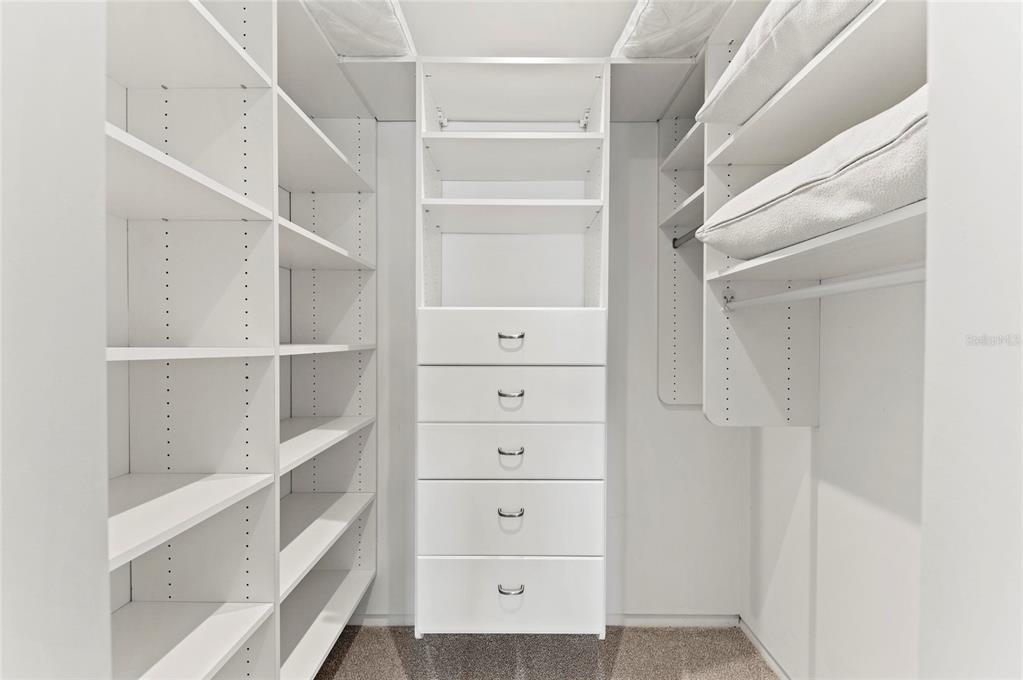350 Golden Gate Point, Unit 61 Sarasota, FL 34236 - Photo 38 of 48 a view of an empty walk in closet