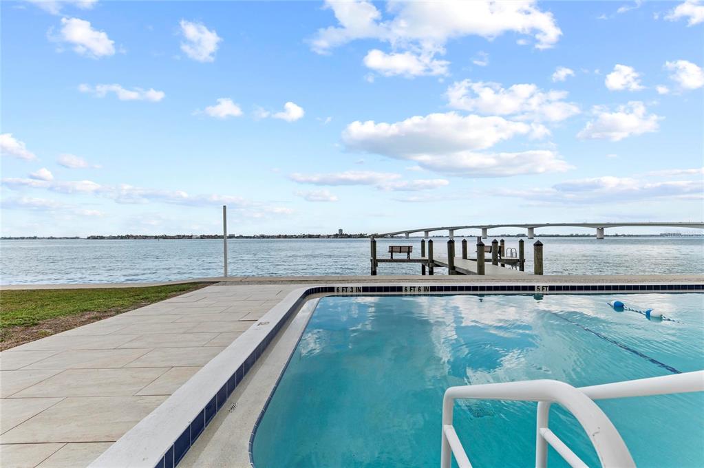 350 Golden Gate Point, Unit 61 Sarasota, FL 34236 - Photo 40 of 48 a view of a swimming pool and an outdoor seating