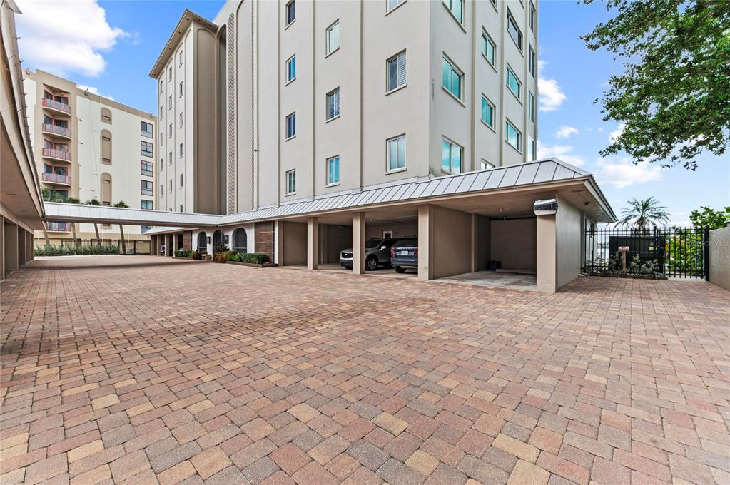 350 Golden Gate Point, Unit 61 Sarasota, FL 34236 - Photo 4 of 48 a view of a building with a bench