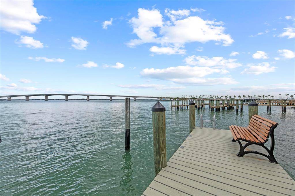 350 Golden Gate Point, Unit 61 Sarasota, FL 34236 - Photo 43 of 48 a view of a lake with table and chairs