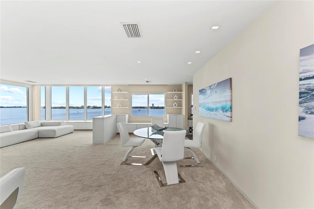 350 Golden Gate Point, Unit 61 Sarasota, FL 34236 - Photo 8 of 48 a living room with furniture and a large window