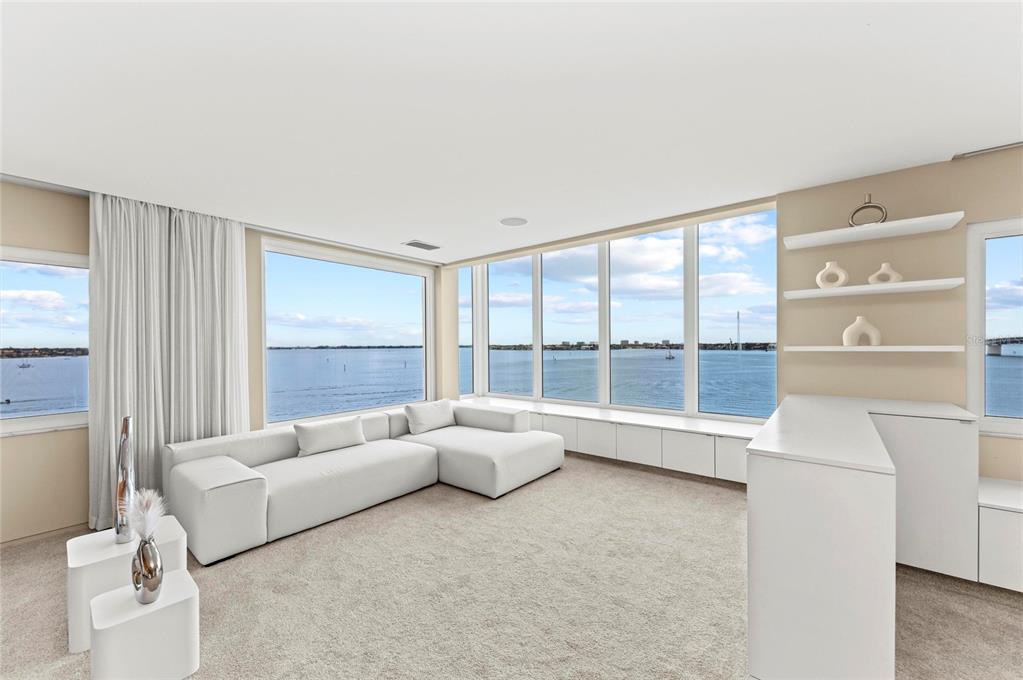 350 Golden Gate Point, Unit 61 Sarasota, FL 34236 - Photo 9 of 48 a living room with furniture and a large window