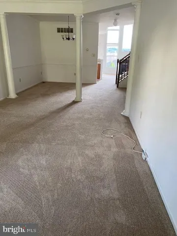 a view of a big room with closet and wooden floor
