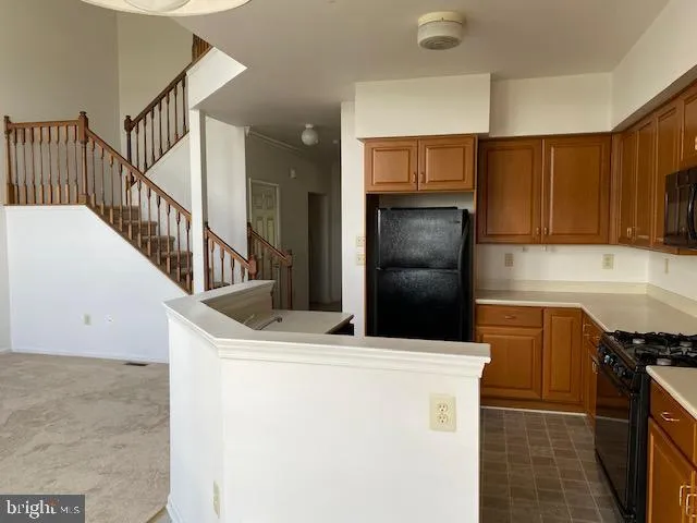 a kitchen that has a sink and a stove in it