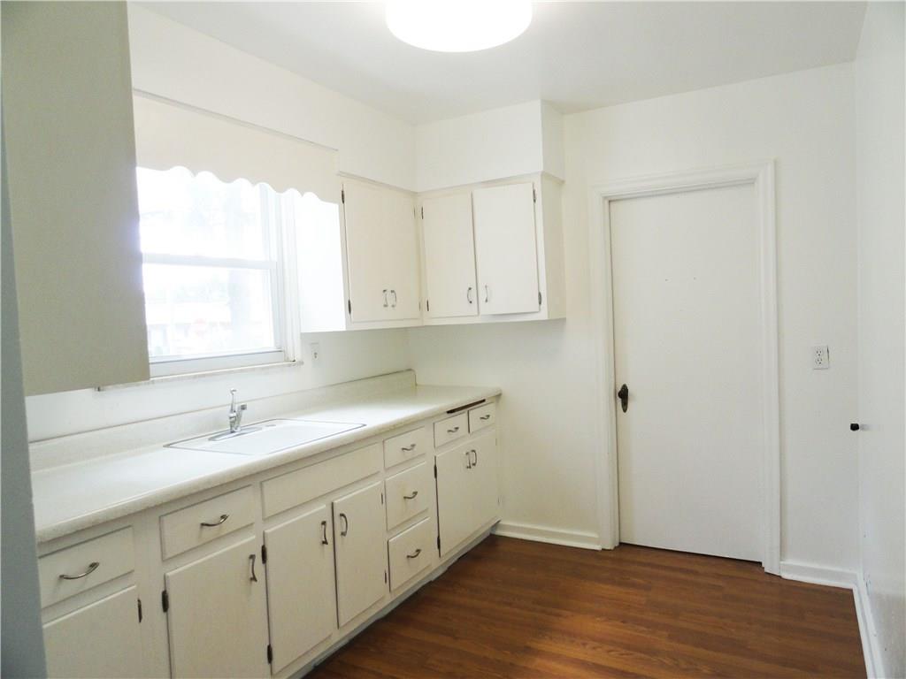 Wood cabinets in kitchen plus large pantry