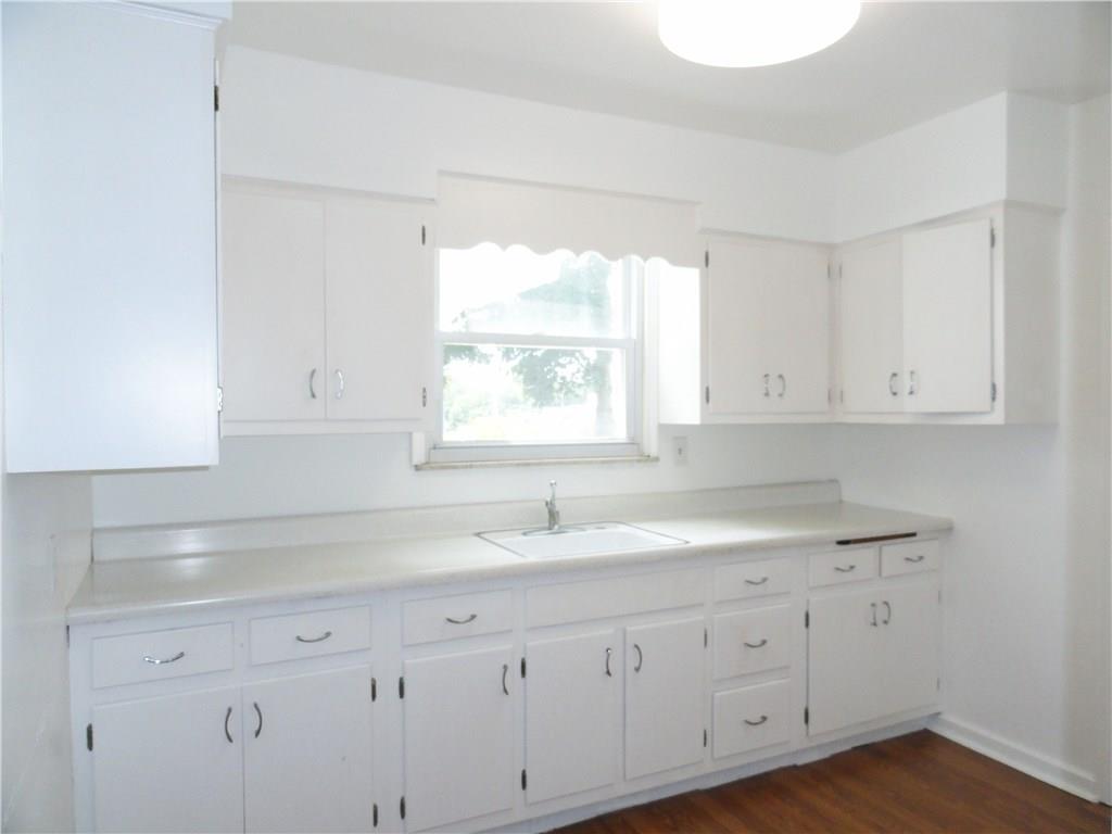 Wood cabinets in kitchen plus large pantry