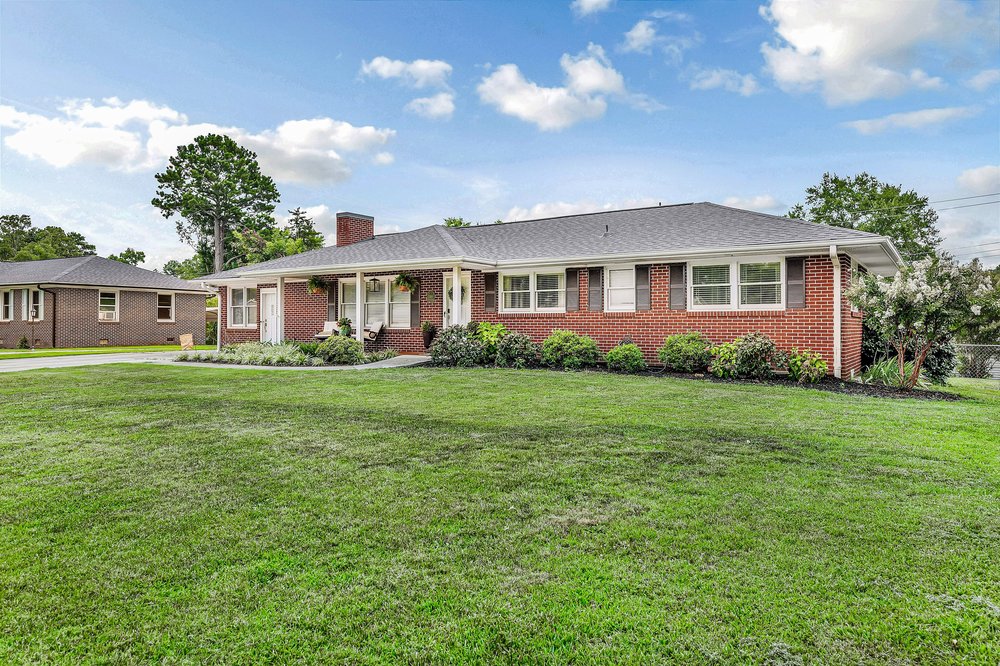 2310 Hannah Road Anderson, SC 29621 - Photo 31 of 32 Well-maintained brick home featuring a lush green lawn and inviting curb appeal.