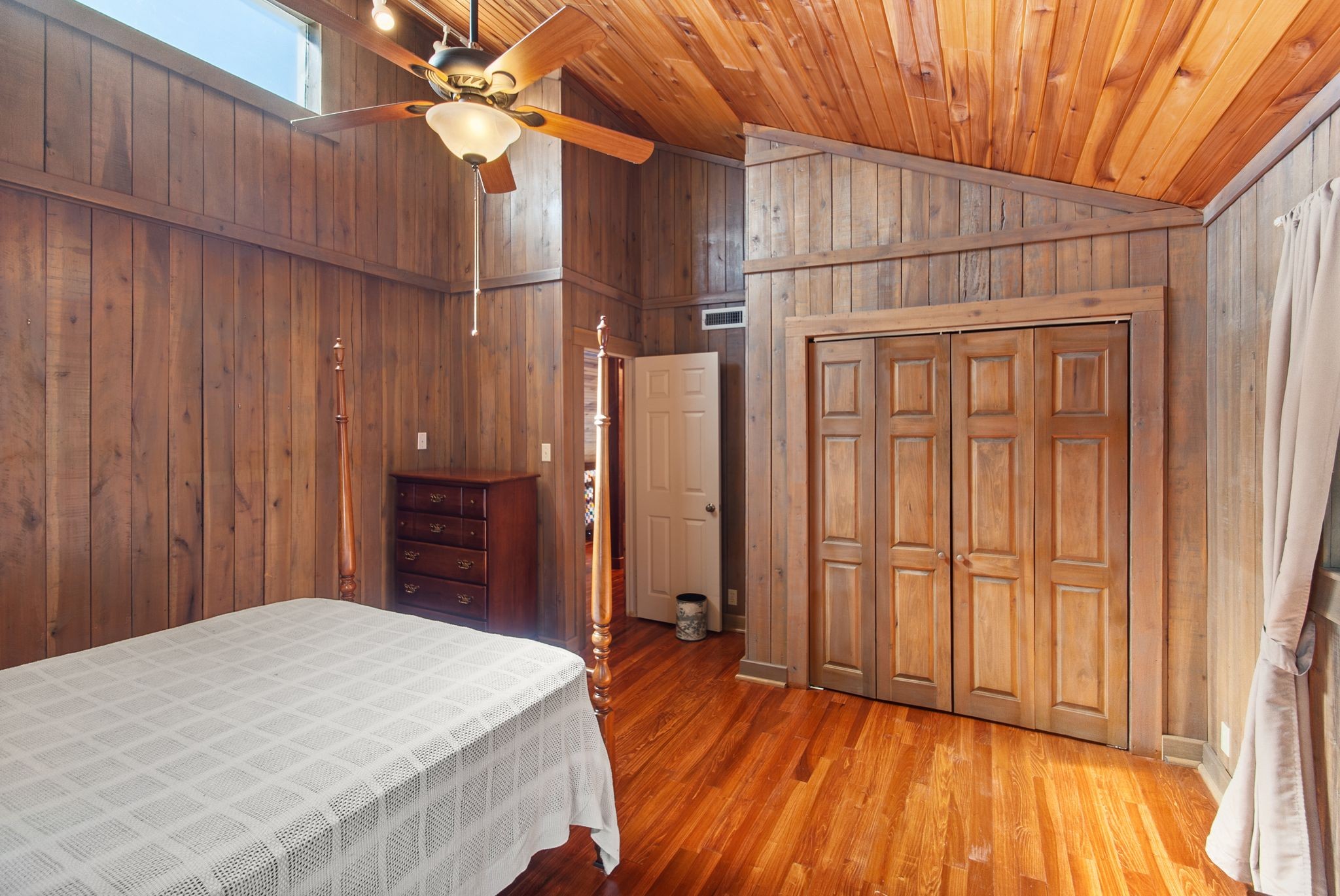 1927 Fowler Hollow Road Lynnville, TN 38472 - Photo 22 of 77 a bedroom with a bed and a chandelier